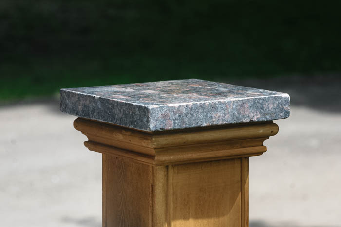 granite post cap with cedar trim for 4x4s and 6x6 